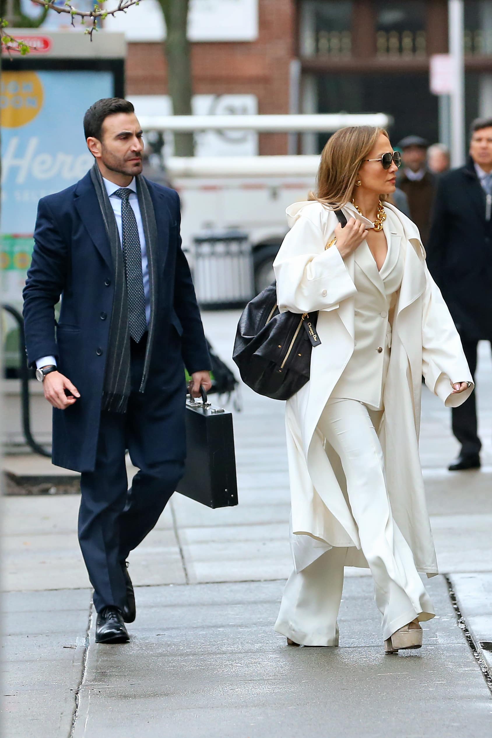 Jennifer Lopez Stuns In A White Business Suit With White Trench Coat Filming 'Office Romance' With Brett Goldstein In Hoboken, Nj 07 Apr 2025
