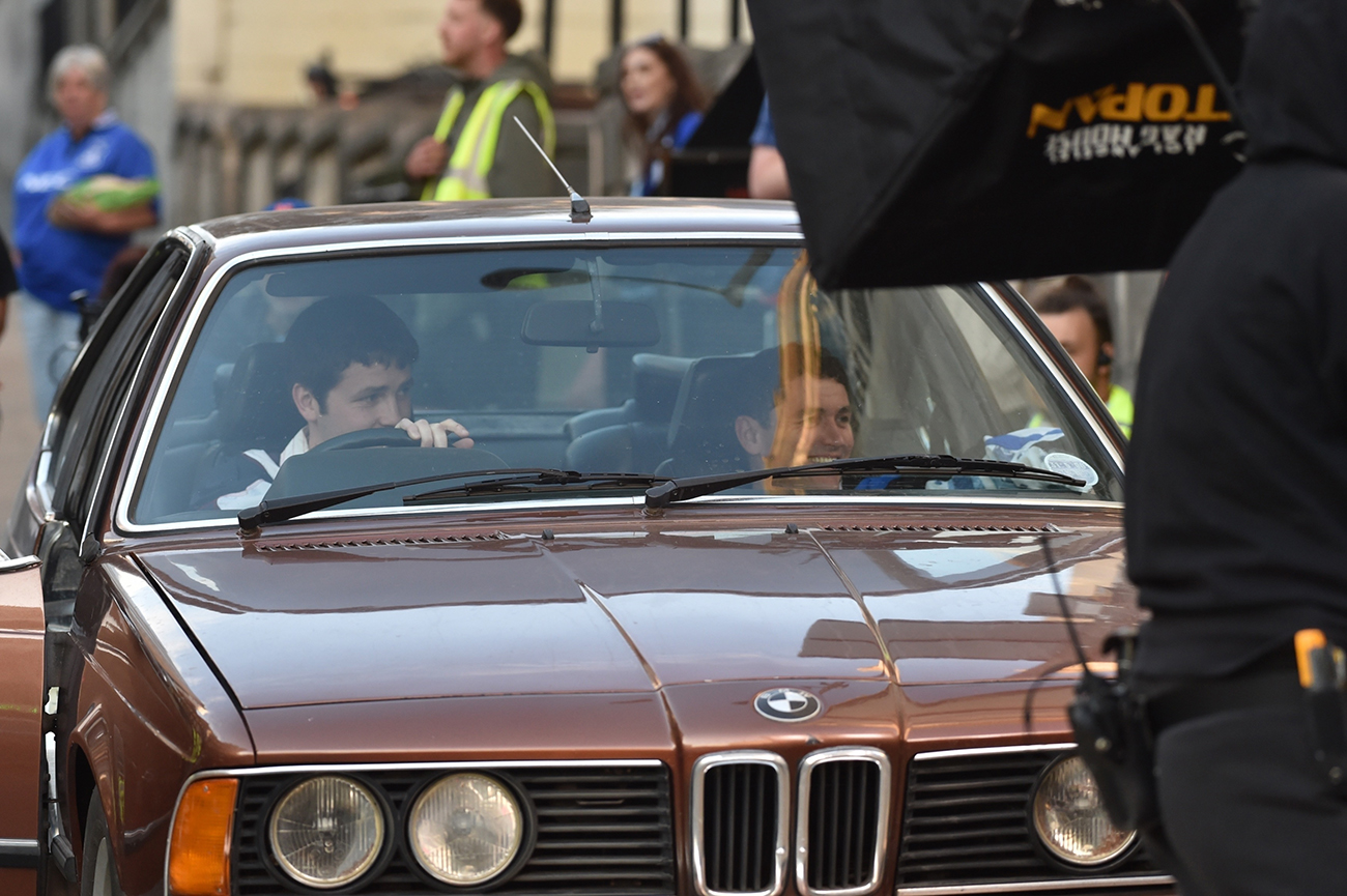 Actors In Classic Brown Bmw On Set Of Legends